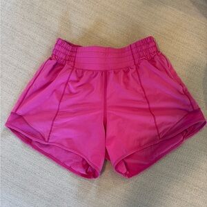 Lululemon Sonic Pink- high rise, hotty-hot,
4in inseam, lightly worn